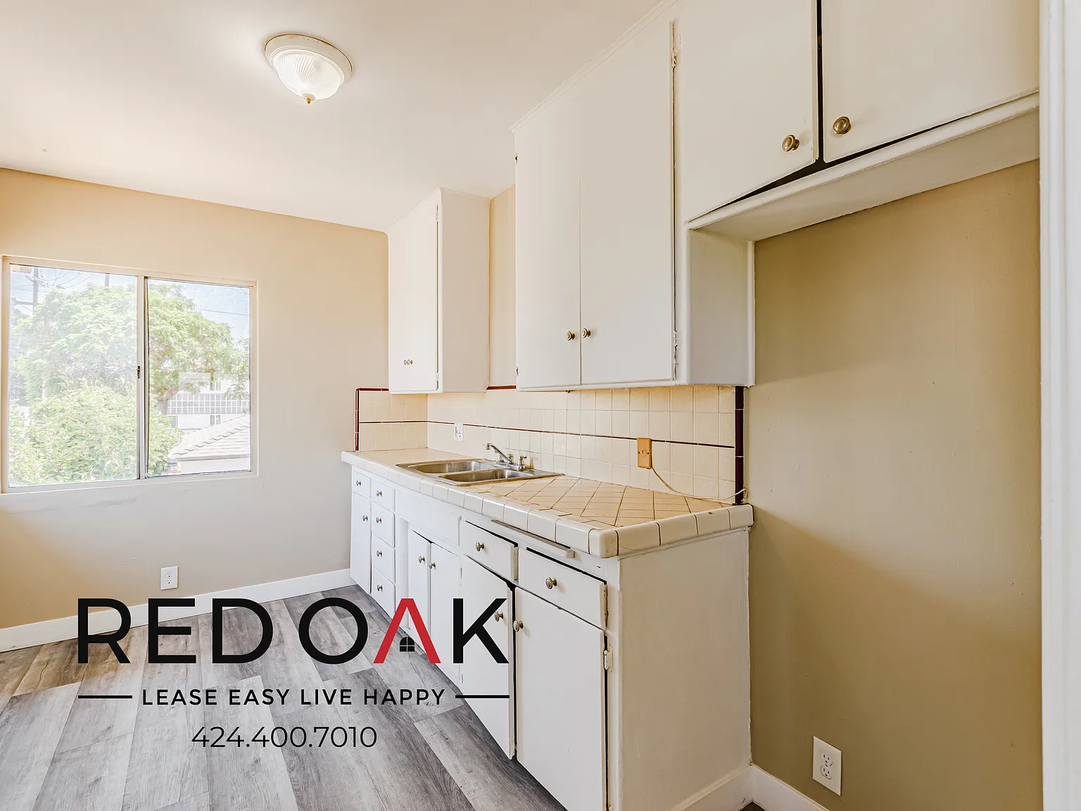 Spacious Three Bedroom with Natural Light and Assigned Parking ~ In Hyde Park! — Photo 2