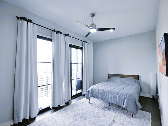 2nd floor bedroom with front patio access.