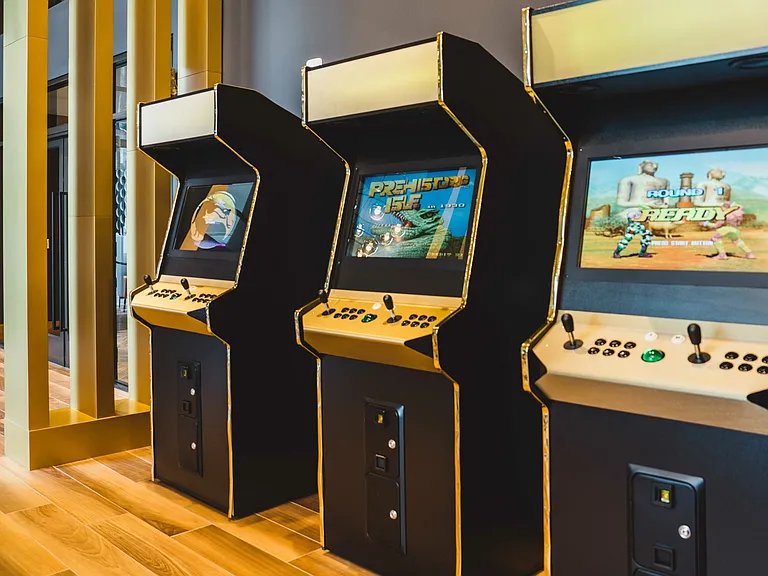 Gaming room with pool table and arcade games