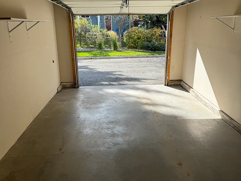 single garage and an extra dedicated parking spot off the deck