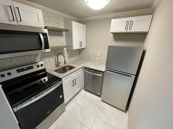 Newly renovated kitchen with stainless steel appliances.