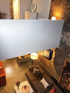 Bedroom above, living below.