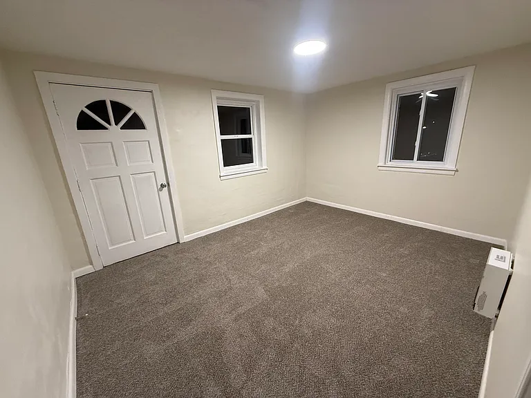Master Bedroom and door leading to back yard