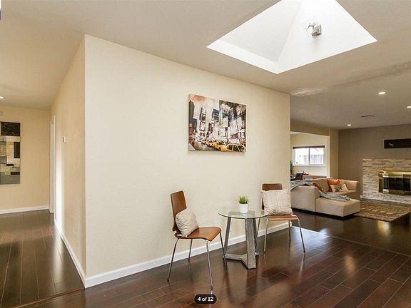 View of remaining house. Lots of Natural light (again the flooring is of different color now). On left, you will have access to all three bedrooms and a guest bathroom. Straight you can see a big family room and on right (not visible) there is a big kitch