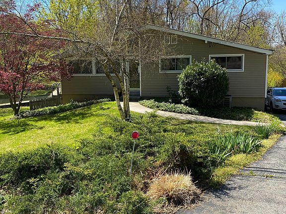 Front view. Driveway on right.