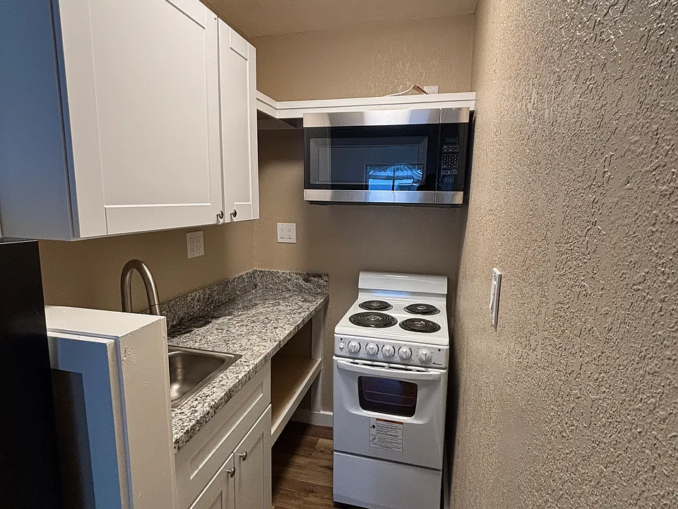 Granite counters with new microwave/vent, range and sink with lots of storage