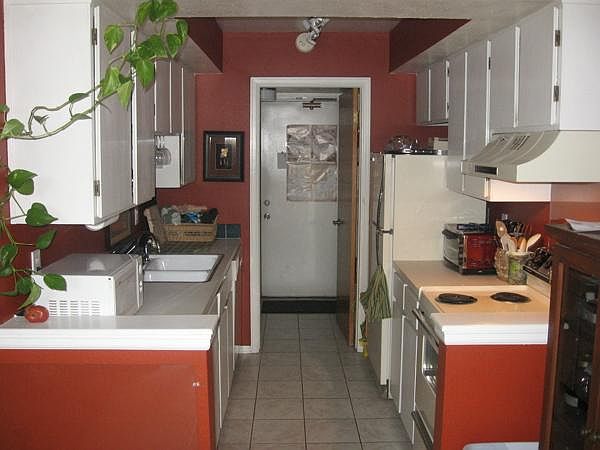 Kitchen, Door to Utility Room, and Back Door to Carport