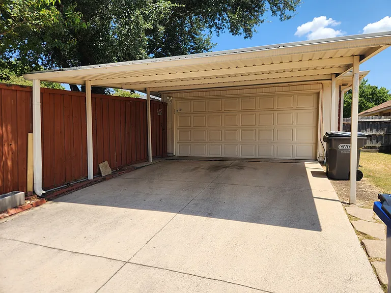 Covered driveway parking in addition to 2 car garage parking. Outdoor security cameras.
