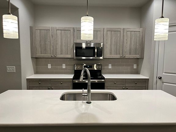 Main Level - Kitchen with quartz counter tops and touch-sensitive faucet