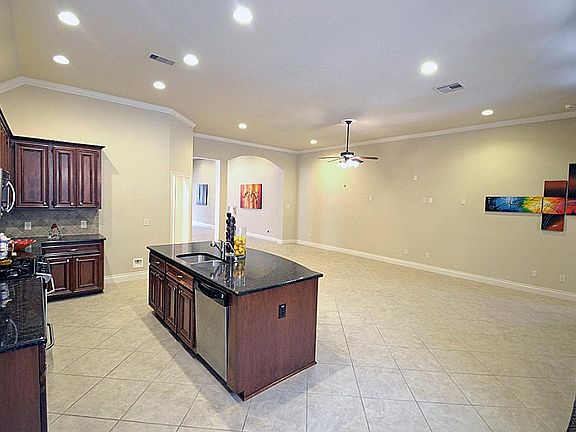 Another view of the open concept of kitchen and living room.
