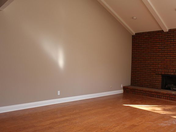 Family room with hardwood floors.