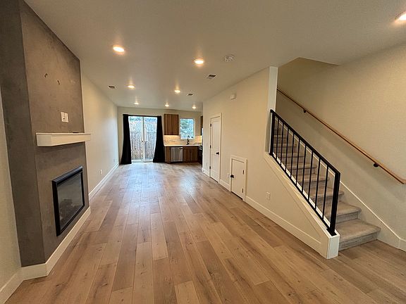 Overall downstairs view - Spacious living room, kitchen, backyard, and bathroom