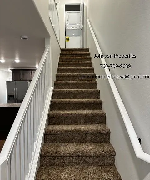 Up stairs to washer and dryer