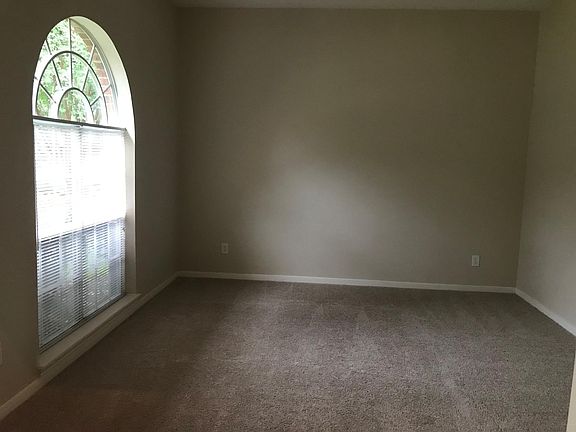 Flex space off the entry is perfect for a home office or playroom.