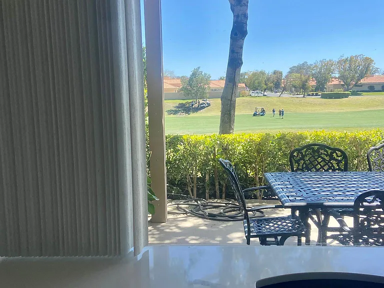 Beautiful natural light from every room. This is a view of the back yard patio and fairway. I'm in love with this view! It's saying morning coffee.