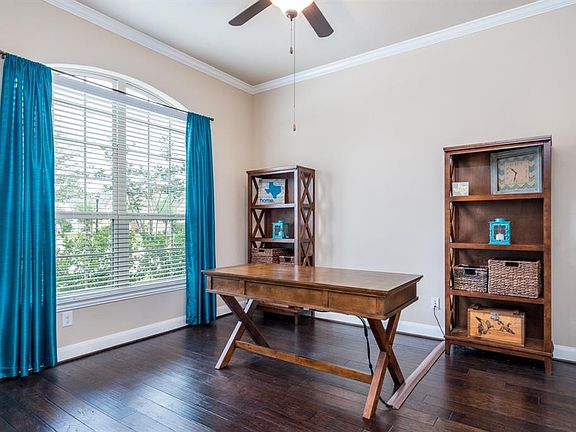 Study has gorgeous hardwood floors, crown molding and glass French doors. Great work space to work from home.