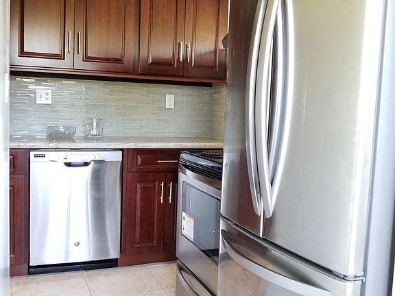 Renovated kitchen: ceramic floors, cherry wood cabinets, gra