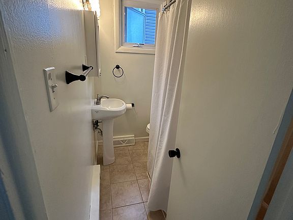 Full bathroom with tub.