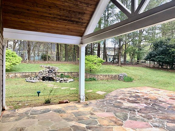 Private 1/2 acre lot. Covered stone patio. Fenced in backyard with waterfall.