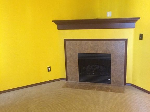 Living Room with gas fireplace and brand new carpet