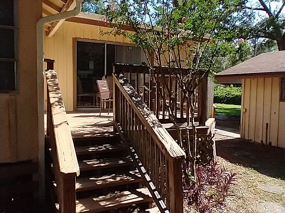 Deck with table and chairs/crepe myrtle tree