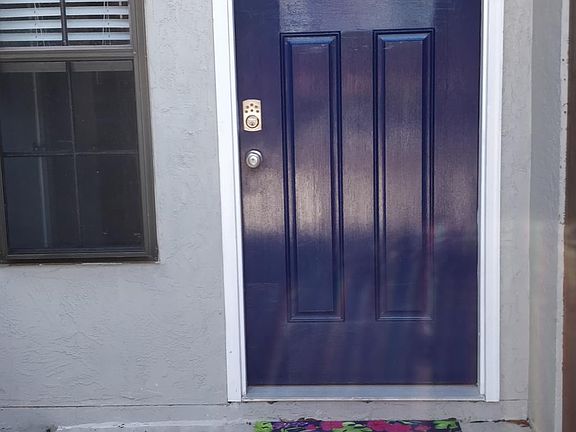 Entryway. New windows are in place now and are trimmed white.
