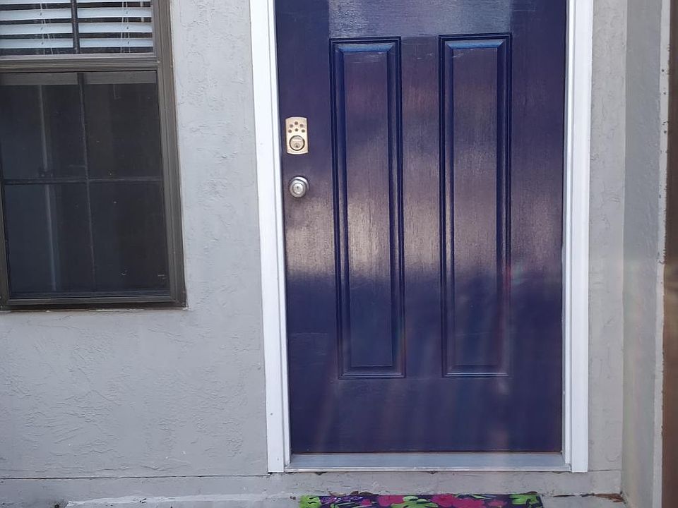 Entryway. New windows are in place now and are trimmed white.