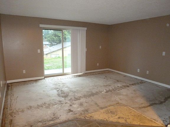 Living room with sliding door to back yard. New paint. New