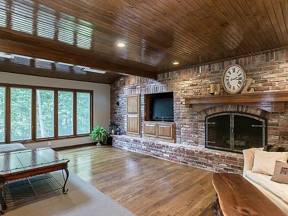 Family room is open to kitchen and adjoins year-round sunroom