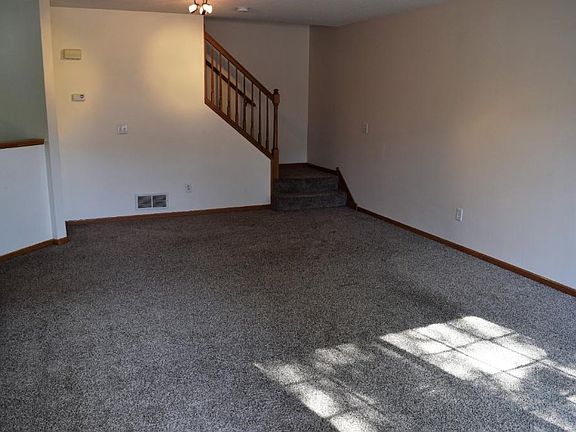 Living room is spacious with open concept to dining and kitchen!