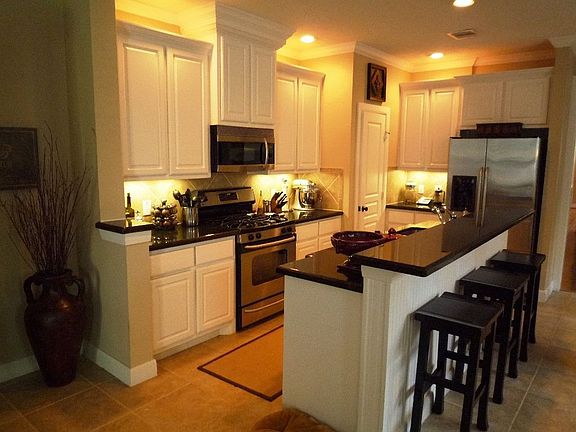 Custom cabinetry and designer lighting