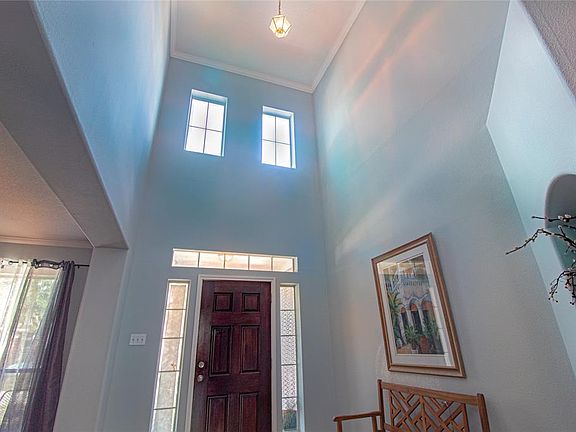 Super high ceilings welcome you as you open the front door.