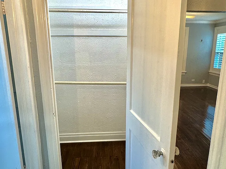 Looking from the bedroom into the 2nd closet, which is located just outside the bathroom.