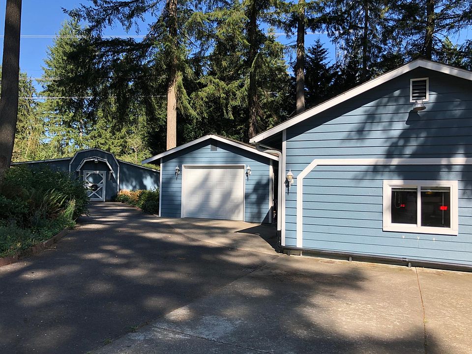 Front of house, garage and barn