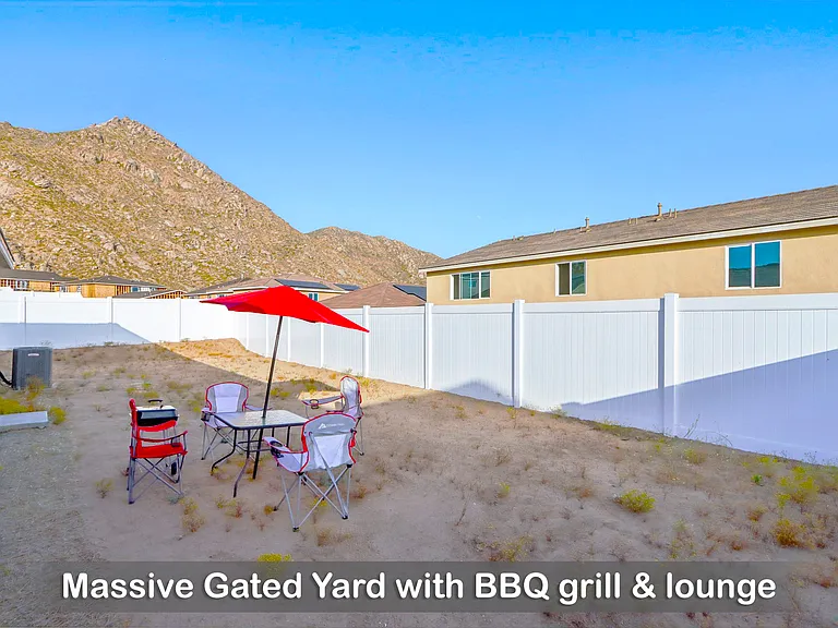 Enjoy a massive gated yard complete with a BBQ grill, perfect for outdoor gatherings and fun!