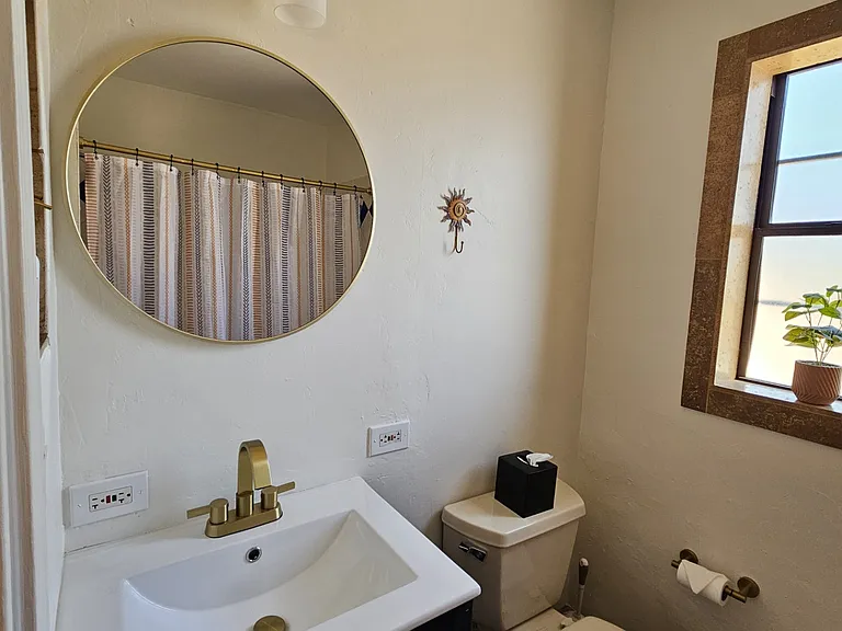 Ensuite bathroom in second bedroom. Tub/shower combo.