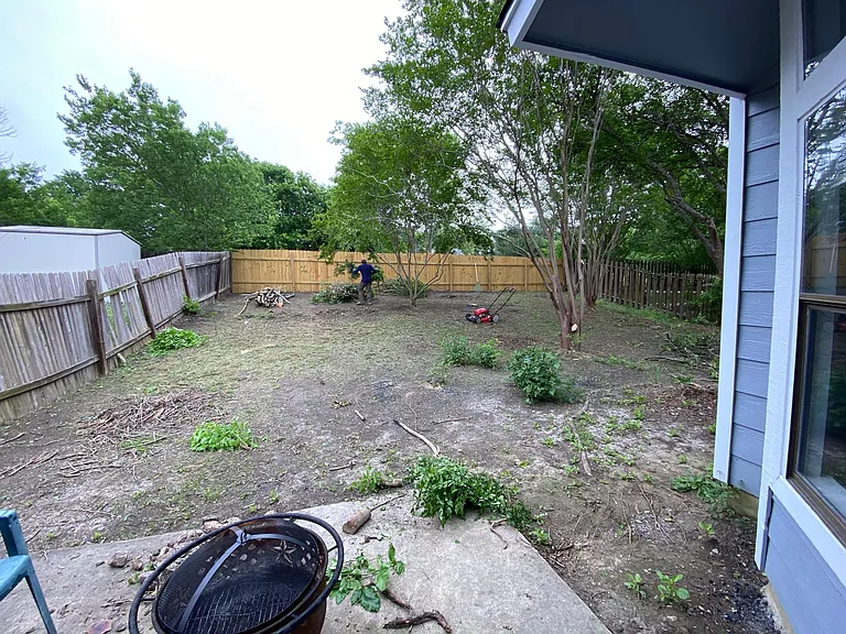 Backyard, still working on cleaning it up a bit more. Fire pit not included.