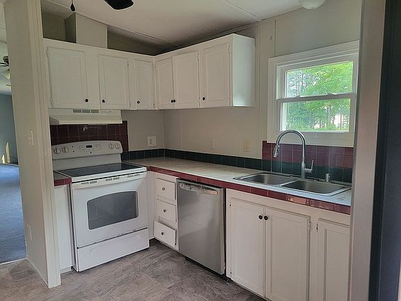 Kitchen open to laundry unit