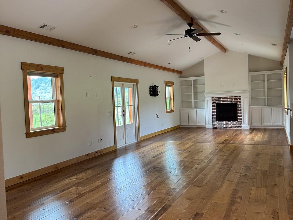 Large living room, french doors to covered porch.
