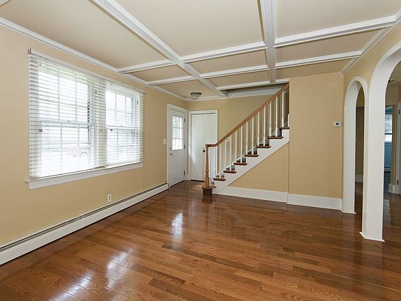 Dining Room with newly refinished, gleaming hardwood floors. Light and Bright.