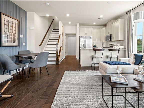 An open concept design blends the living room, dining area and kitchen together for seamless everyday living