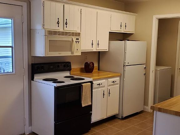 Adjoining updated kitchen with access to laundry and garage