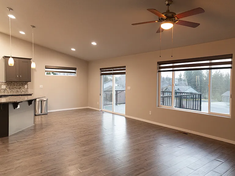 Open Floor Space from the kitchen into the living room . All blinds are energy-efficient Hunter-Douglas throughout the entire house.