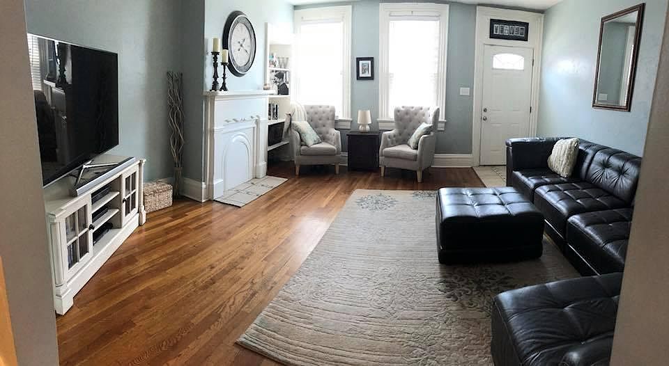 Spacious family room with hard wood floors and built ins