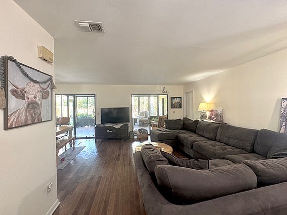 UPDATE! Beautiful new lighter wood, wide plank flooring has just been installed since these photos.
