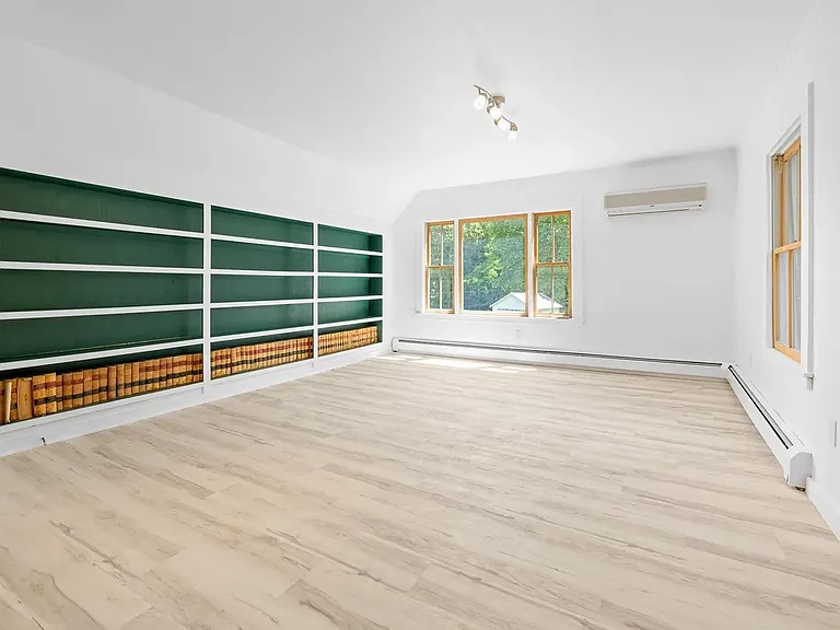 Living Room - Second Floor. The large window faces South and light pours in. That's the wall AC unit on the right.