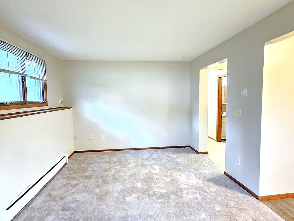 Large living room and dining area off of the kitchen. One of the outlets is connected to the light switch for lamp lighting.