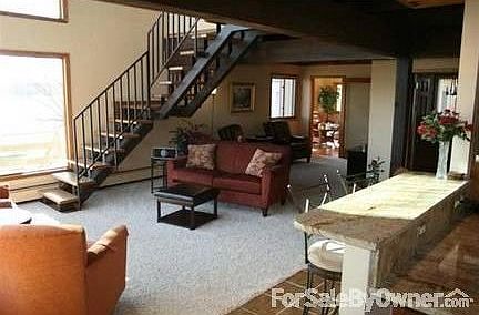 Partial Living Room Area. New Oak and Iron Staircase, Windows & Carpeting