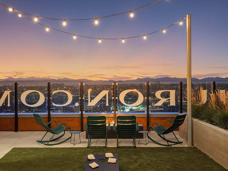 Cozy up on the rooftop with a warm fireplace and ambient lighting, perfect for evening relaxation.