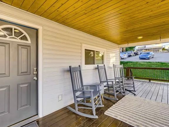 Charming covered front porch _ perfect for morning coffee or evening relaxation, just steps from WVU Hospital and Campus.